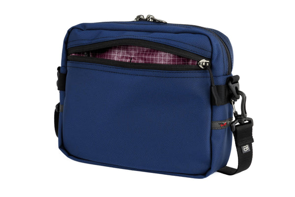 The Side Kick in Deep Blue (dark blue) Ballistic with an Acai (dark purple with white grid) 210 Cerylon interior.